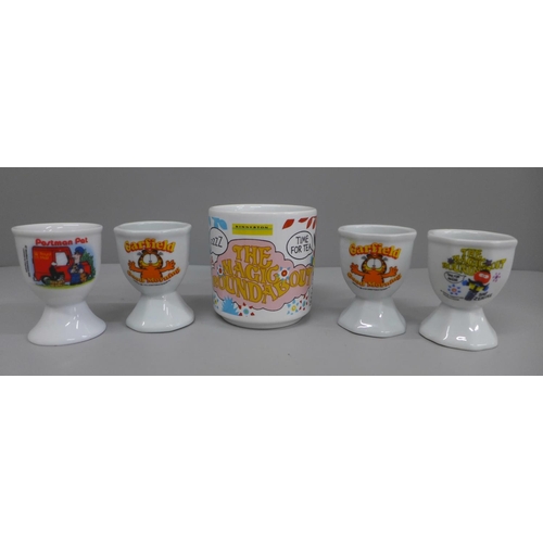 650 - Collectors egg cups, Garfield, Postman Pat, The Magic Roundabout and a mug