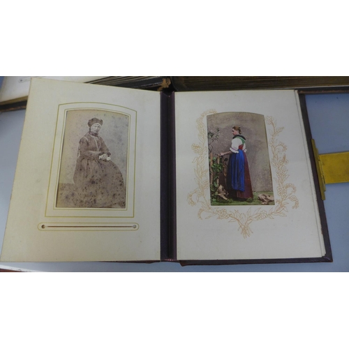 661 - Two carte de visite albums and cabinet cards