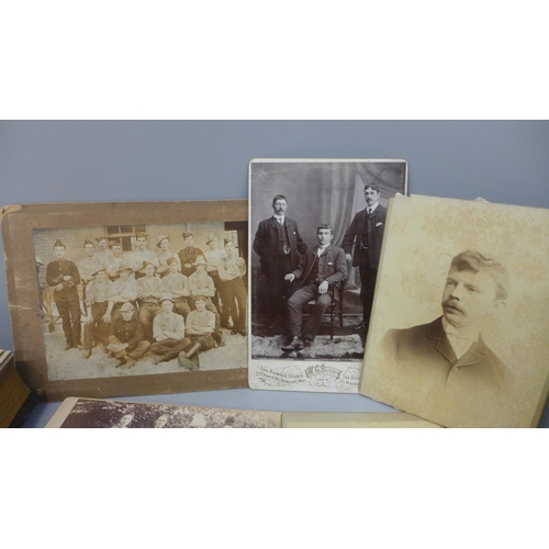 661 - Two carte de visite albums and cabinet cards