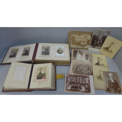 661 - Two carte de visite albums and cabinet cards