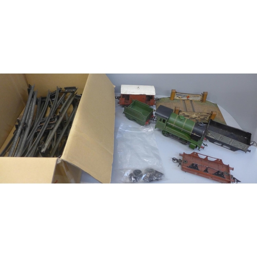 669 - A 1940's 0 gauge tin plate train set with Hornby locomotive and tender