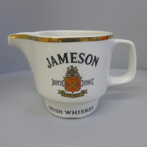 695 - A Carlton Ware Red Baron teapot and a Jameson Irish whiskey jug