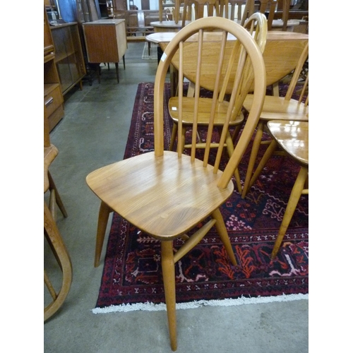 100 - A set of Ercol Blonde elm and beech Windsor chairs