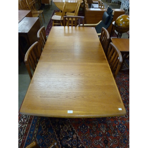 103 - A Meredew teak extending dining table and six chairs