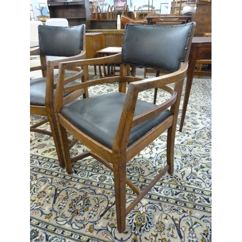 11 - A pair of oak Art Deco Heals style oak desk chairs