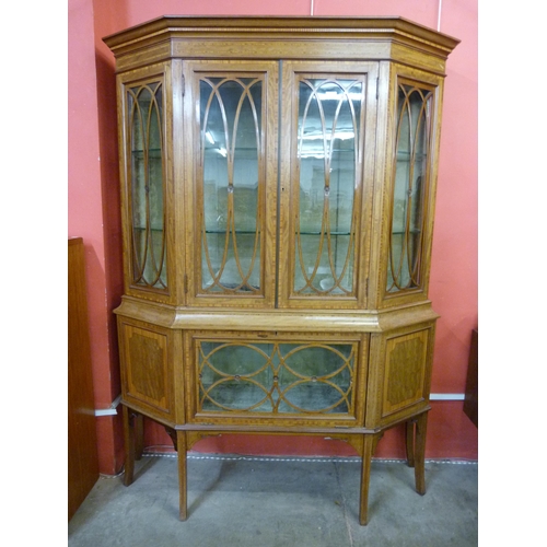 12 - An Edward VII mahogany and satinwood inlaid breakfront display cabinet