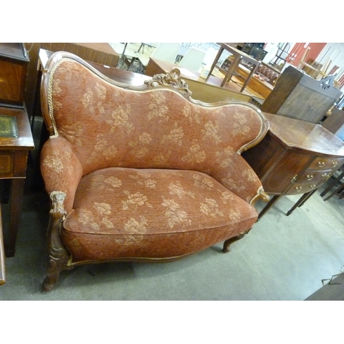 142 - An early 20th Century French carved beech and fabric upholstered settee