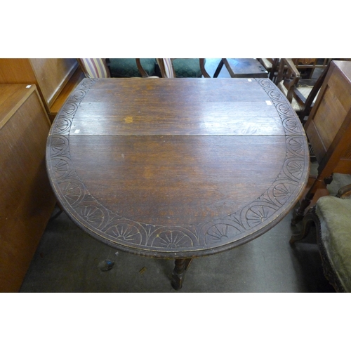 152 - A carved oak gateleg table