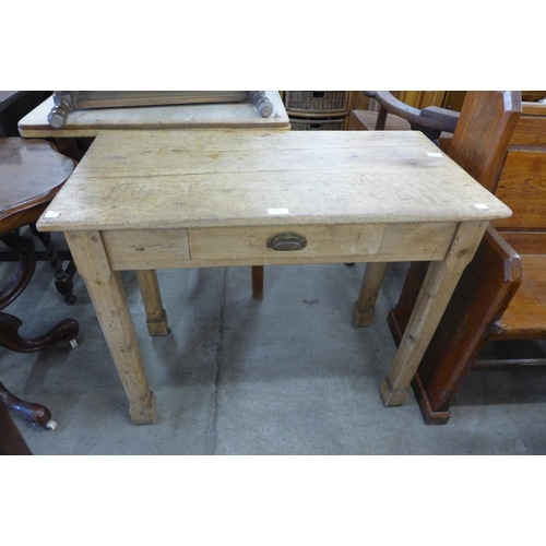 175 - A Victorian waxed pine single drawer kitchen table