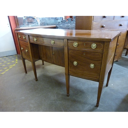 19 - A Regency inlaid mahogany bow front sideboard