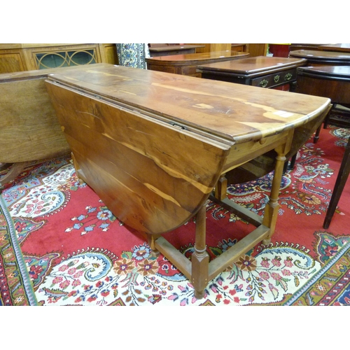 20 - A George III style yew wood gateleg wake table