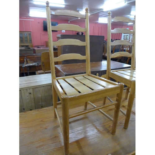 204 - An Ercol ash refectory table and six ladderback chairs