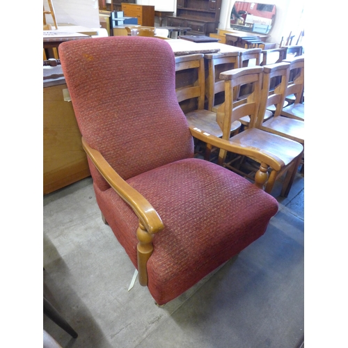 216 - A Victorian style walnut and red fabric upholstered open armchair