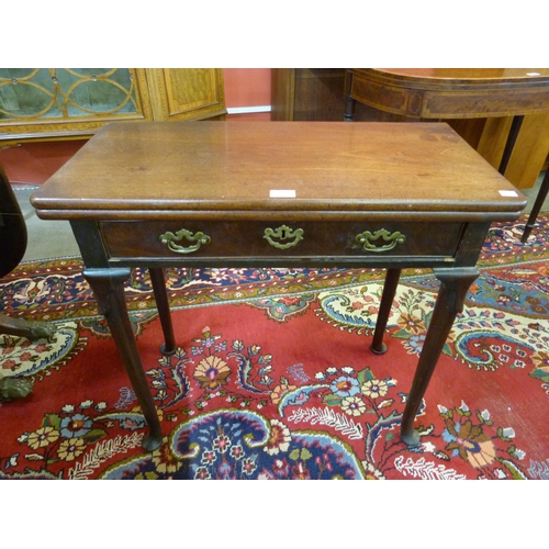 22 - A George II mahogany fold over rectangular single drawer tea table