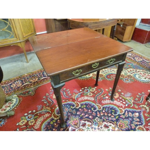 22 - A George II mahogany fold over rectangular single drawer tea table