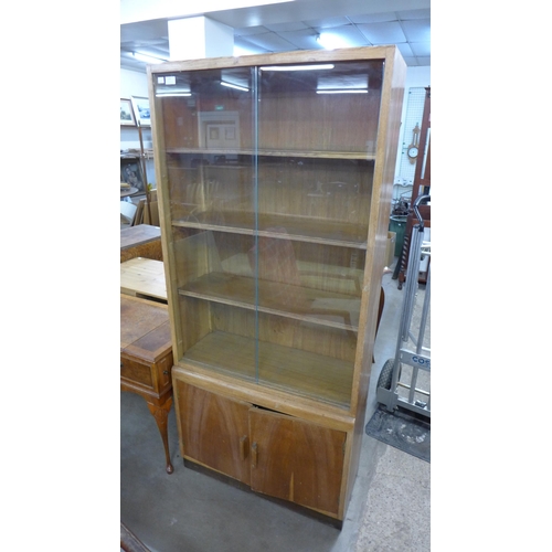 230 - A vintage light oak bookcase