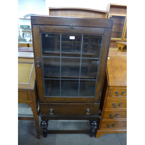 234 - An oak single door bookcase