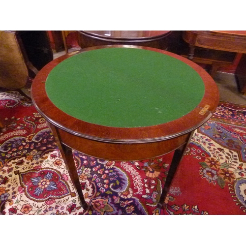 24 - An Edward VII mahogany demi lune fold-over games table