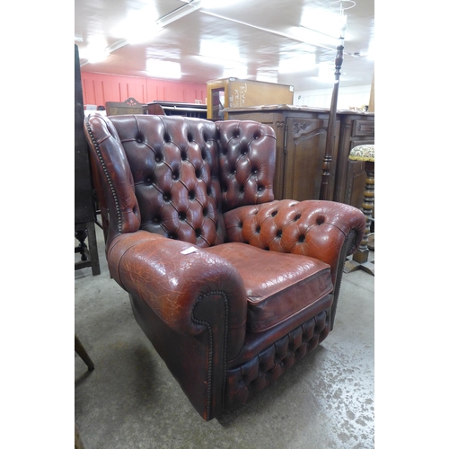 250 - A red leather Chesterfield armchair