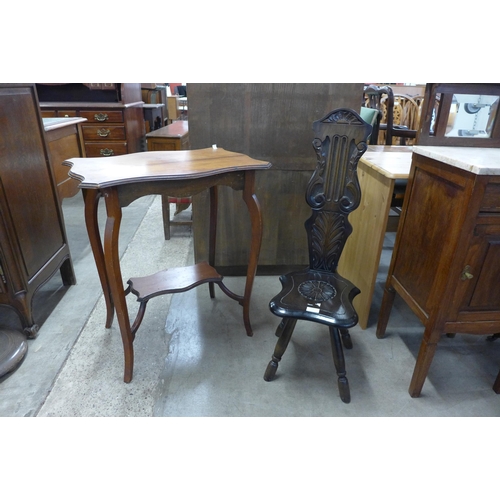 254 - A carved mahogany spinning stool and a walnut occasional table