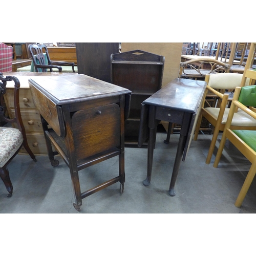 256 - A small oak open bookcase, a George II  mahogany drop leaf table and an oak trolley