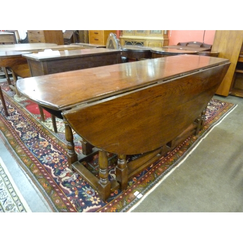 26 - A George III style oak gateleg wake table