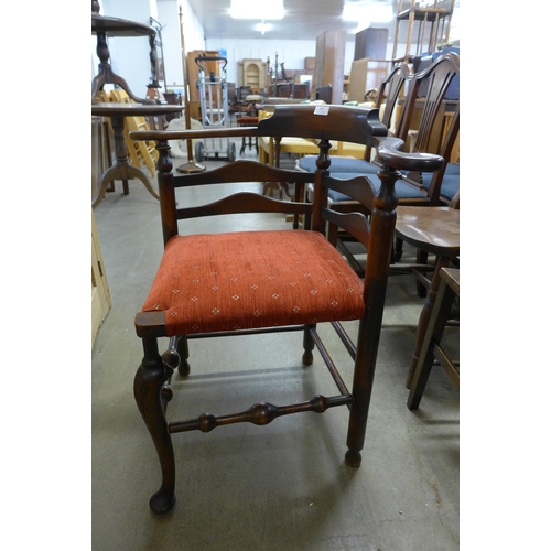 261 - A George III style carved mahogany corner chair