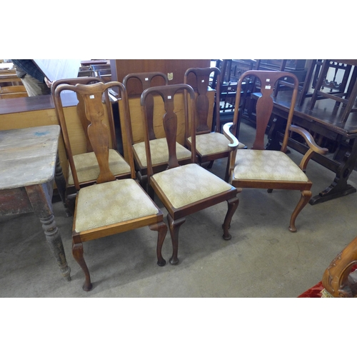 263 - A set of six Queen Anne style walnut dining chairs