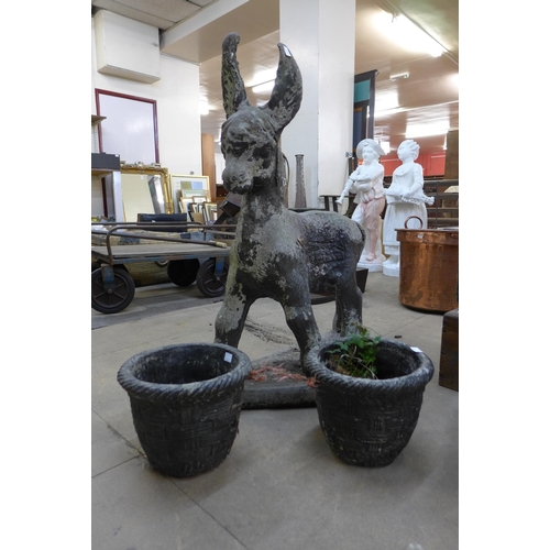 286 - A concrete garden figure of a donkey and two planters