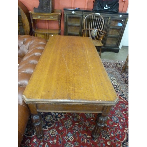 30A - A Victorian oak two drawer library table