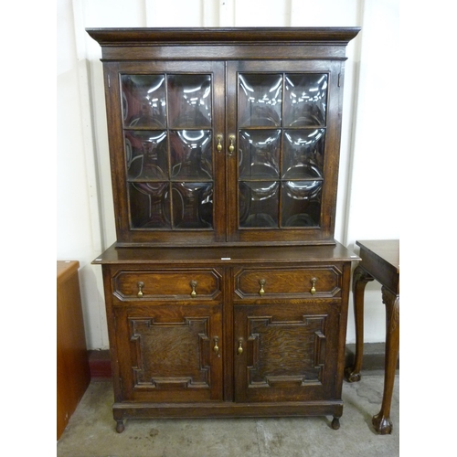 31 - A 17th Century style carved oak geometric moulded bookcase