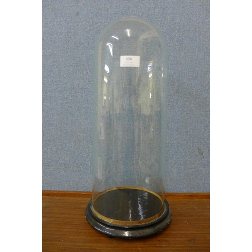 338 - A glass specimen bell jar, on ebonised stand