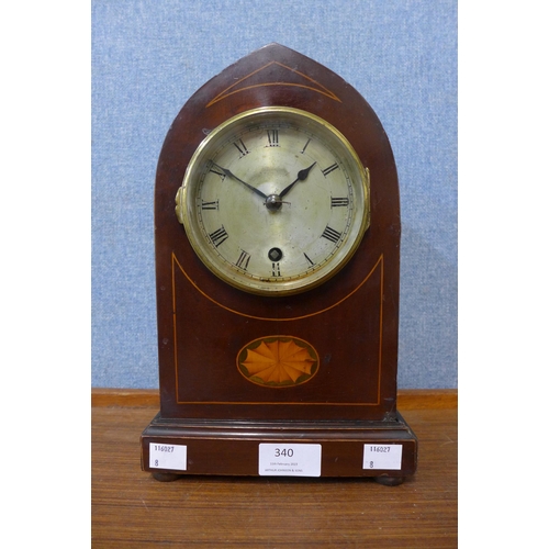 340 - An Edward VII inlaid mahogany lancet shaped mantel clock