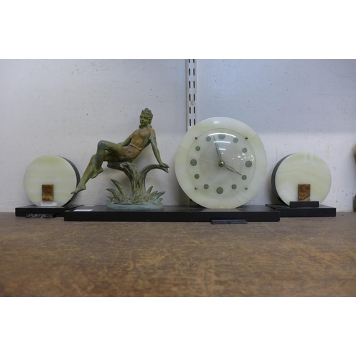 342 - An Art Deco onyx, slate and figural spelter clock garniture