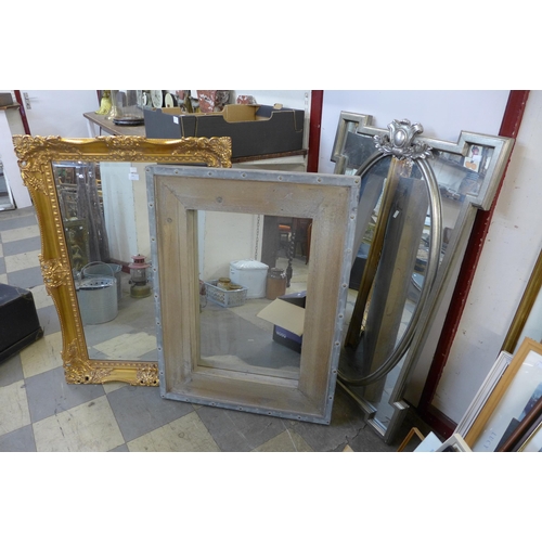 345 - A gilt framed mirror, an industrial style mirror and one other