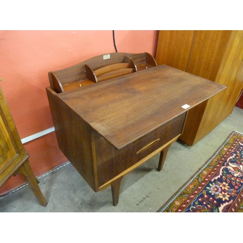 49 - A Jentique teak metamorphic chest/desk