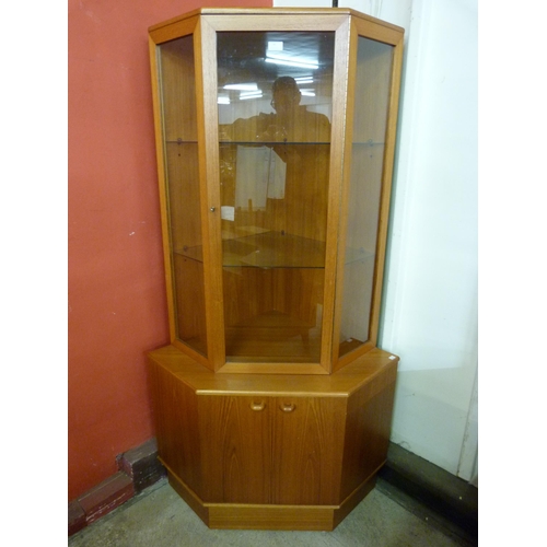 50 - A Turnidge of London teak corner cabinet