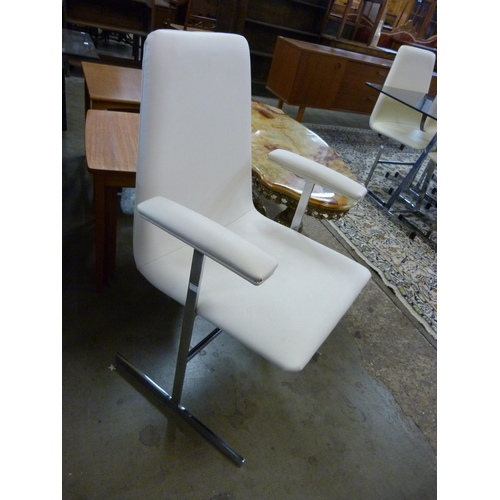 79 - A 1970's Pieff chrome and glass topped trestle dining table and six chairs, designed by Tim Banks