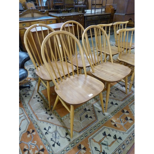 86 - A set of four Ercol Blonde elm and beech Windsor chairs