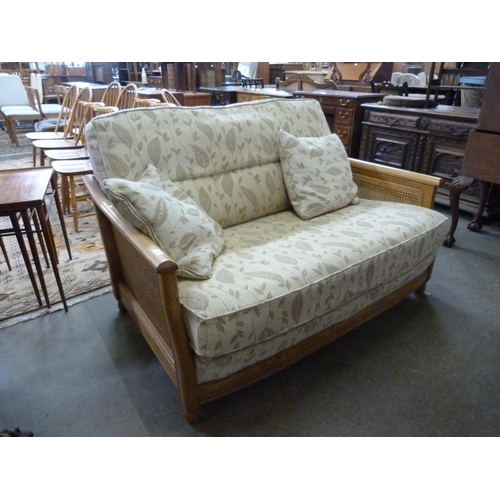 89 - An Ercol Blonde ash settee