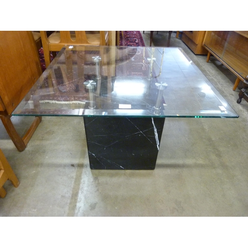 97 - A Italian style black marble and glass topped coffee table