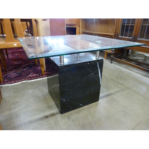 97 - A Italian style black marble and glass topped coffee table