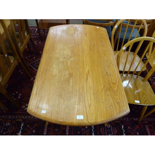 99 - An Ercol elm and beech Windsor drop leaf table