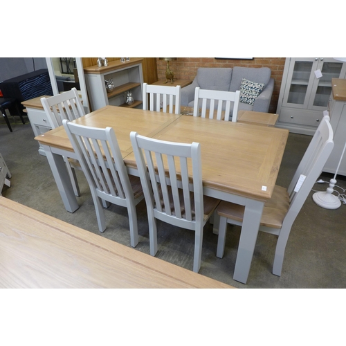 1321 - An extension dining table - 1.8-2.3m and six vertical slatted chairs  * This lot is subject to VAT