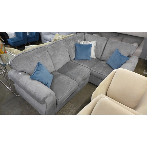 1337 - A small grey upholstered corner sofa