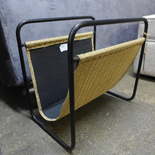 1352 - A rattan and iron magazine rack  * This lot is subject to VAT