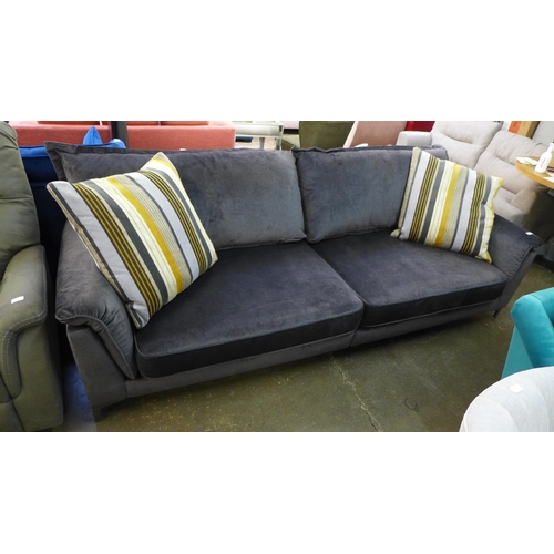 1366 - A slate velvet four seater sofa