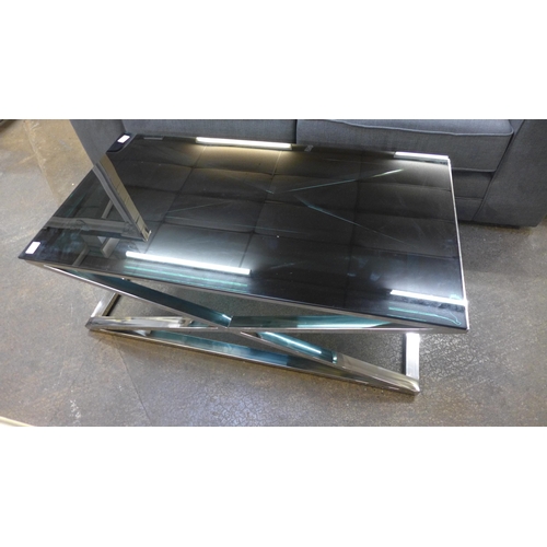 1379 - A chrome and black glass coffee table