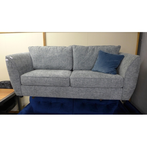 1389 - An aquamarine upholstered three seater sofa