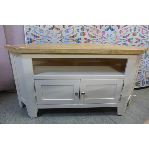 1398 - A 90 degree corner TV unit with two doors and 2 shelves  * This lot is subject to VAT